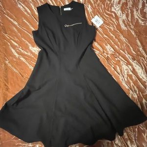 Black and gold sleeveless Calvin Klein dress.